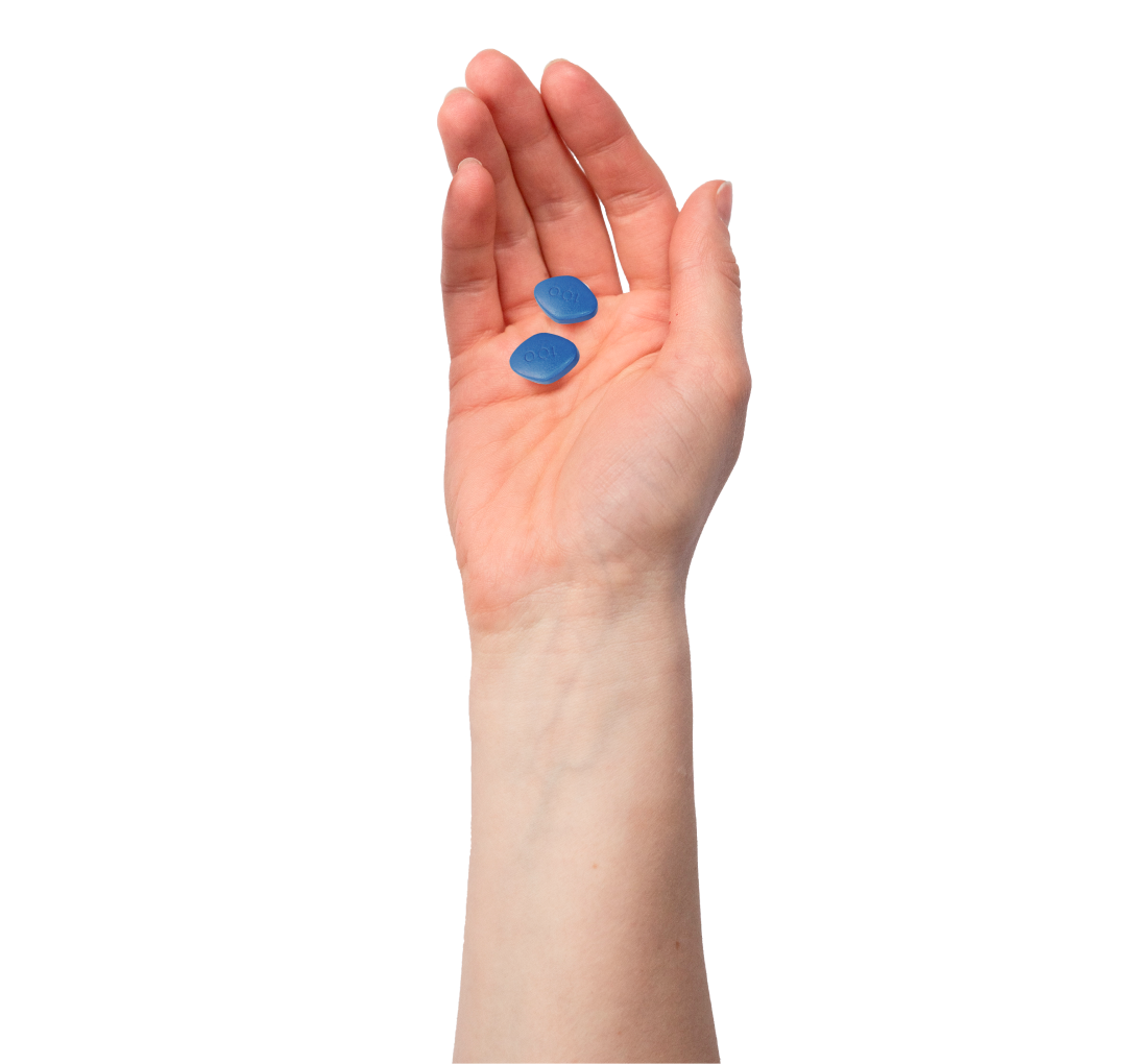 hand holding blue Viagra pill