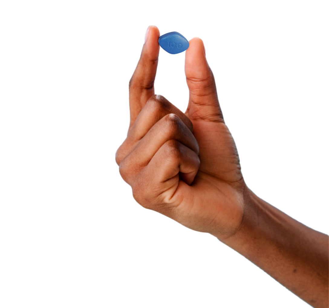 hand holding blue Viagra pill